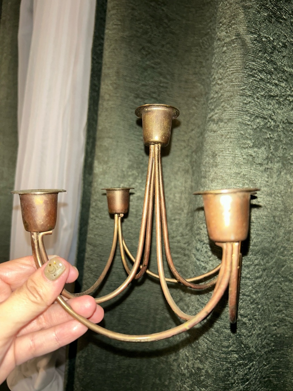 vintage Mid-Century Modern brass candelabra featuring a delicate, curved design